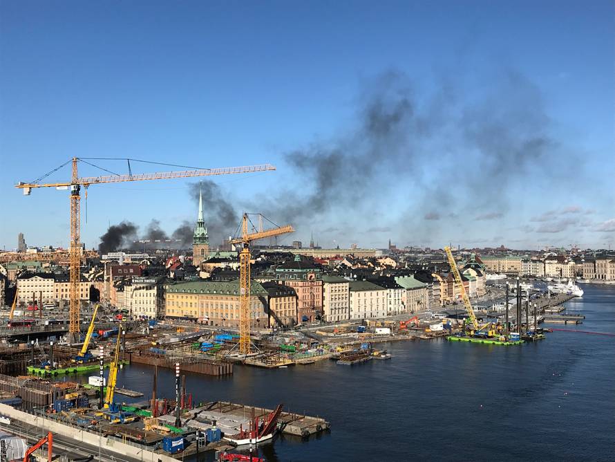 Smoke from a bus explosion and fire is seen in Tegelbacken in central Stockholm