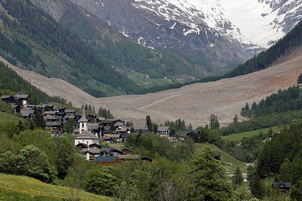 Debris lies from a crumbling glacier that partially collapsed and tumbled behind Wiler, near Blatten, Switzerland