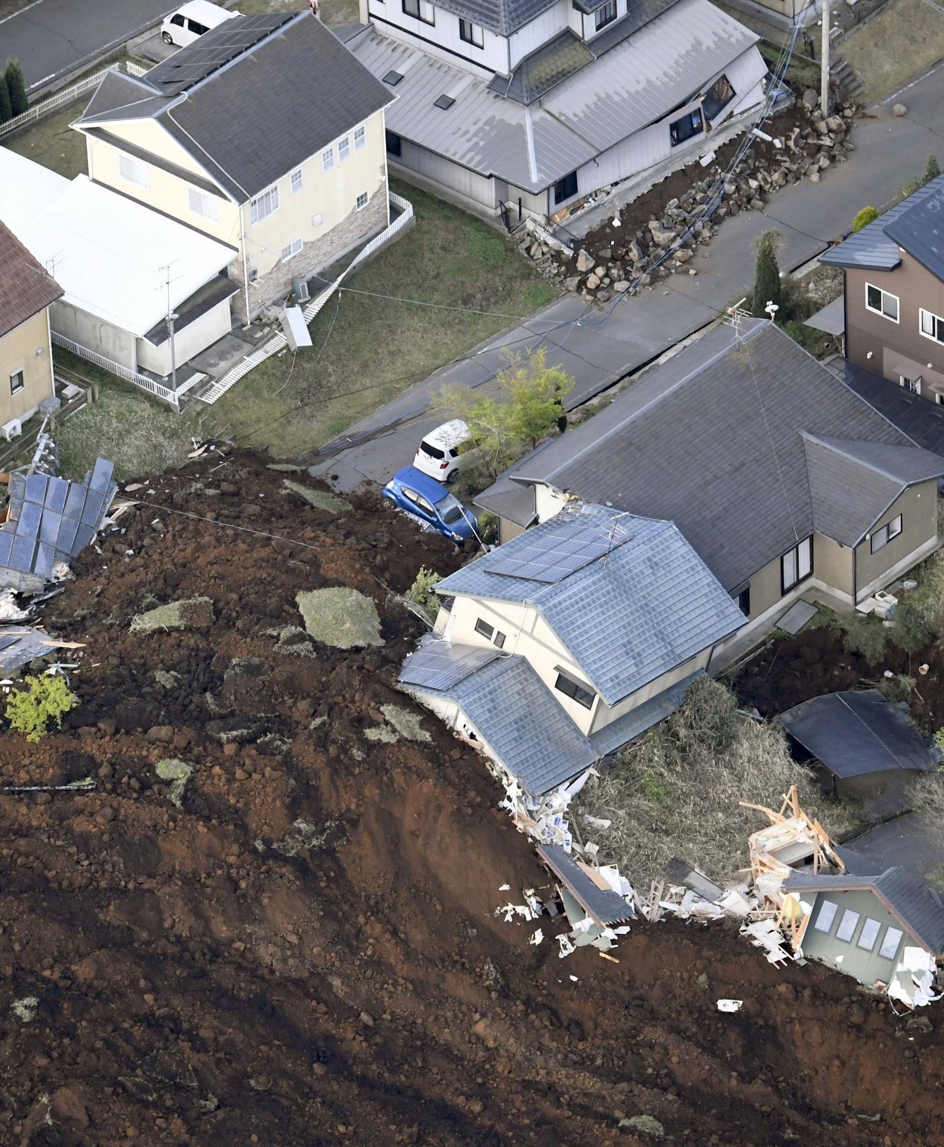The aftermath of a landslide and destroyed houses caused by an earthquake are seen in Minamiaso town, Kumamoto prefecture