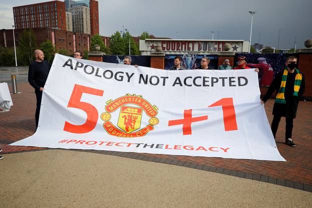 Manchester United fans protest against their owners before the Manchester United v Liverpool Premier League match