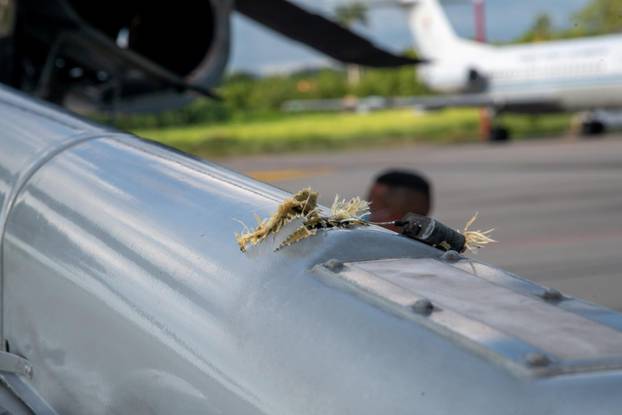 The mark of a projectile impact is seen on a helicopter that Colombian President Ivan Duque was traveling in, after it suffered an attack during an overflight, according to authorities, in Cucuta