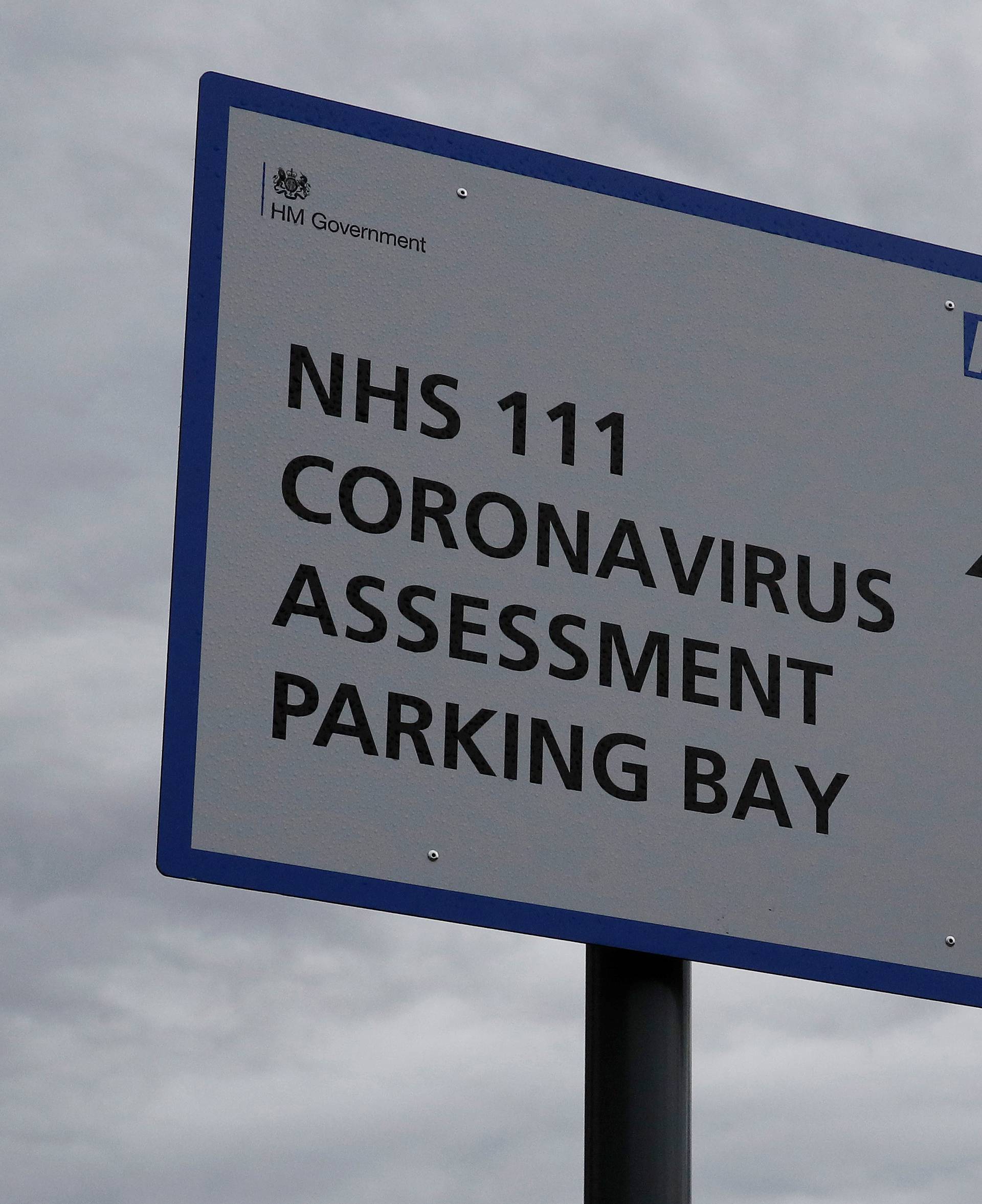 Signage directing patients towards a Coronavirus assessment bay is seen outside Whiston Hospital in Liverpool