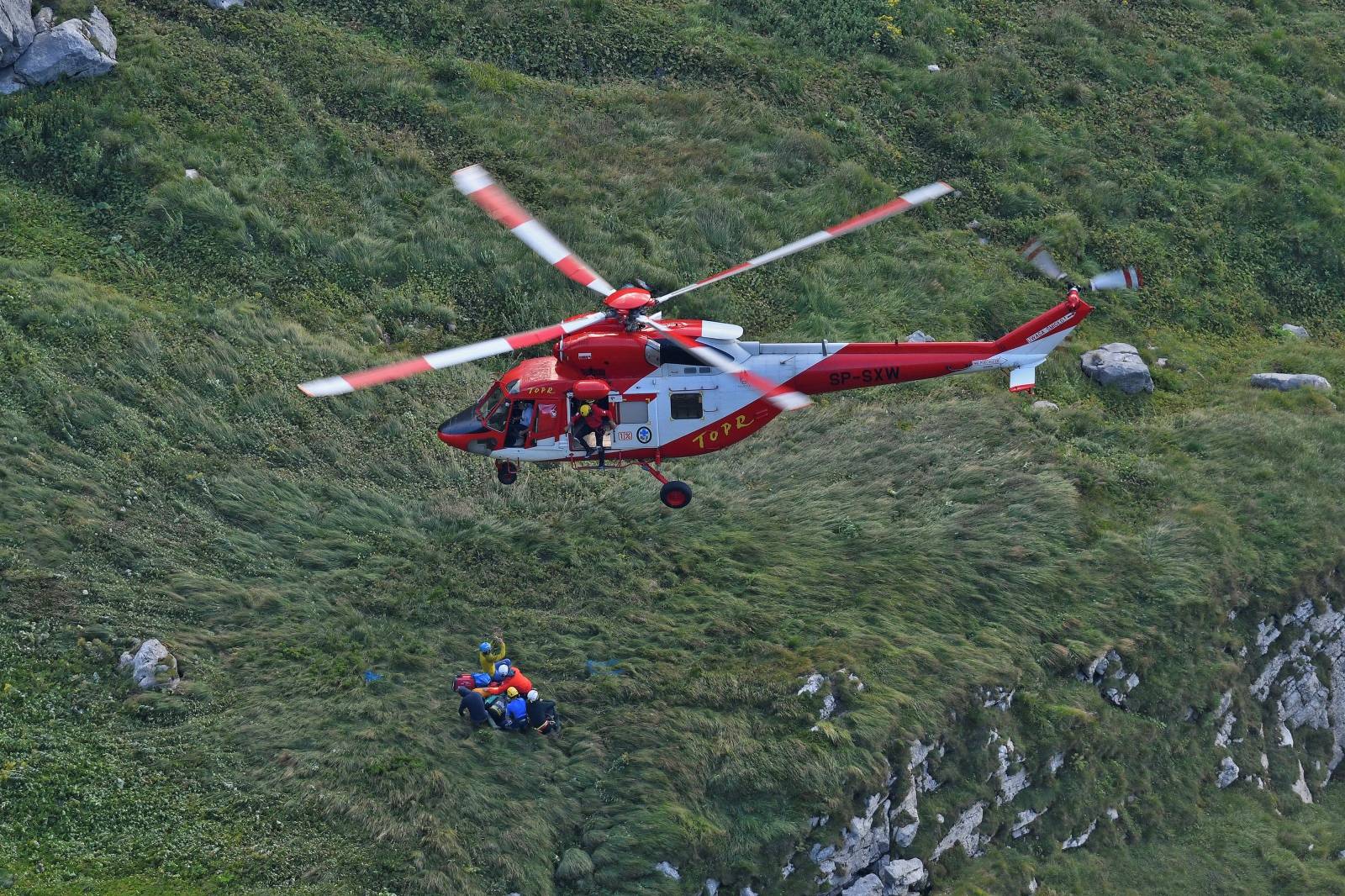Mountain rescue team (TOPR) helicopter is pictured in Tatra mountains during a search mission near Zakopane