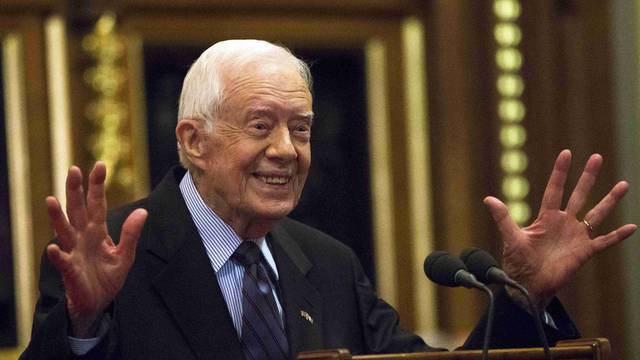 Former U.S. President Jimmy Carter delivers a lecture on the eradication of the Guinea worm, at the House of Lords in London