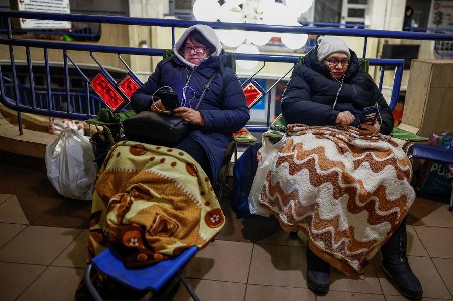 People take shelter inside a metro station during overnight Russian missile and drone attack, in Kyiv