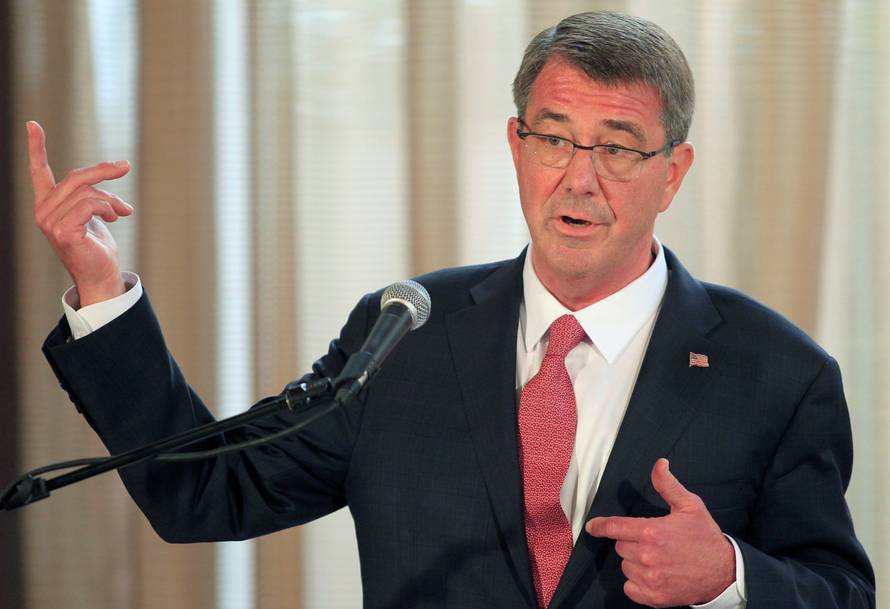 Visiting U.S. Defense Secretary Ash Carter gestures during a joint press conference with his Filipino counterpart Voltaire Gazmin at the presidential palace in Manila  