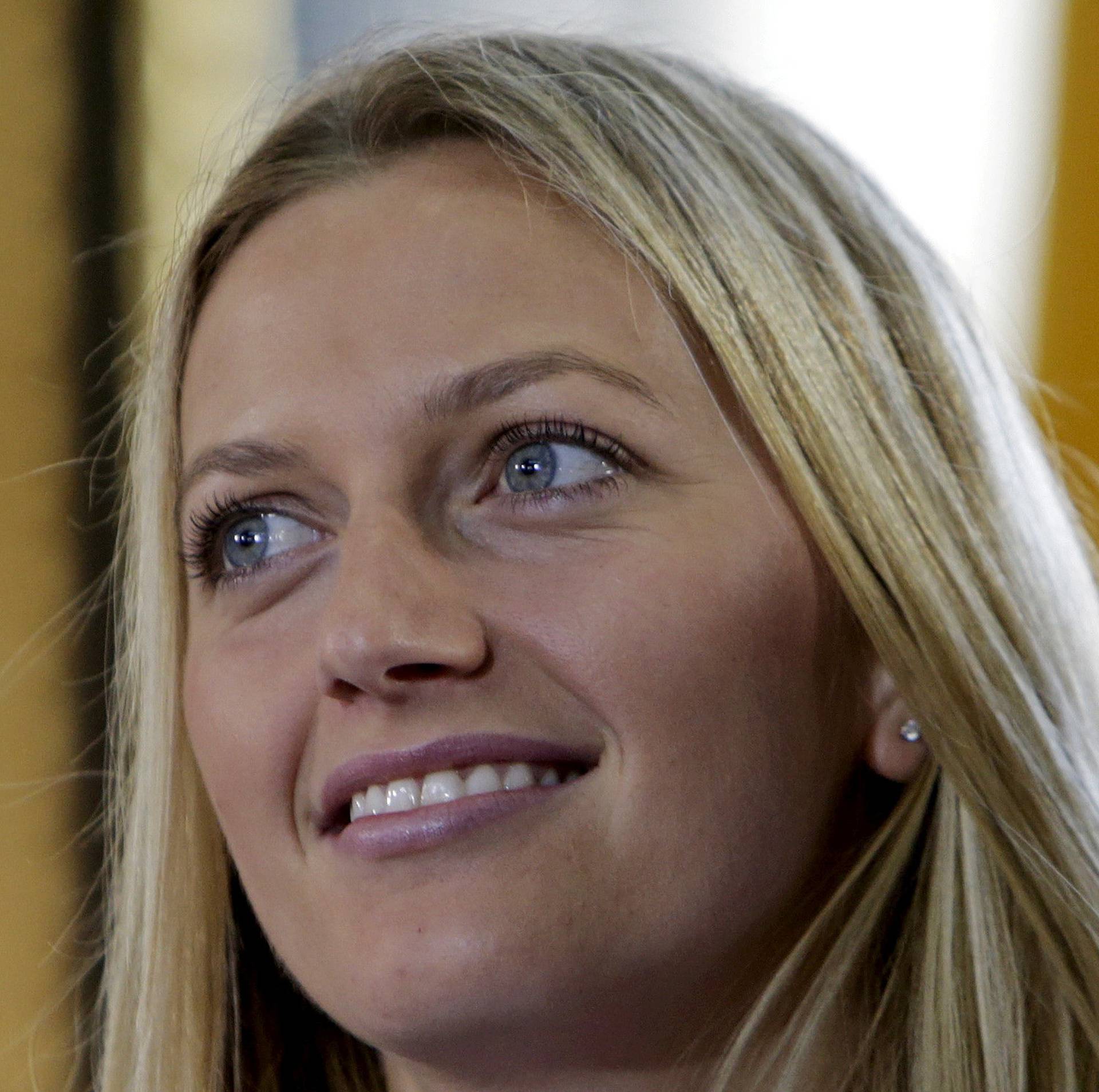 FILE PHOTO: Czech Republic's Petra Kvitova smiles during the draw for the Fed Cup final in Prague