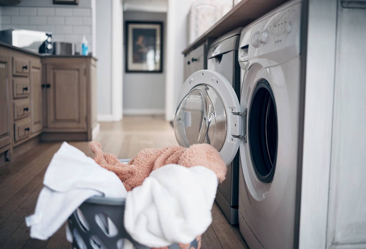 Shot of a laundry basket filled with freshly dried clothes