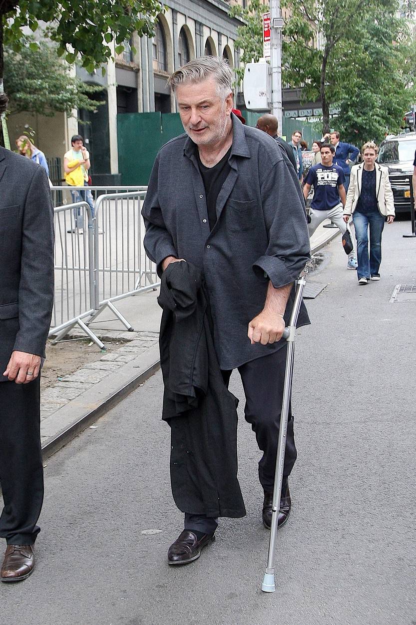*EXCLUSIVE* Alec Baldwin walks with the help of a walking stick as he is seen out for the first time since his surgery