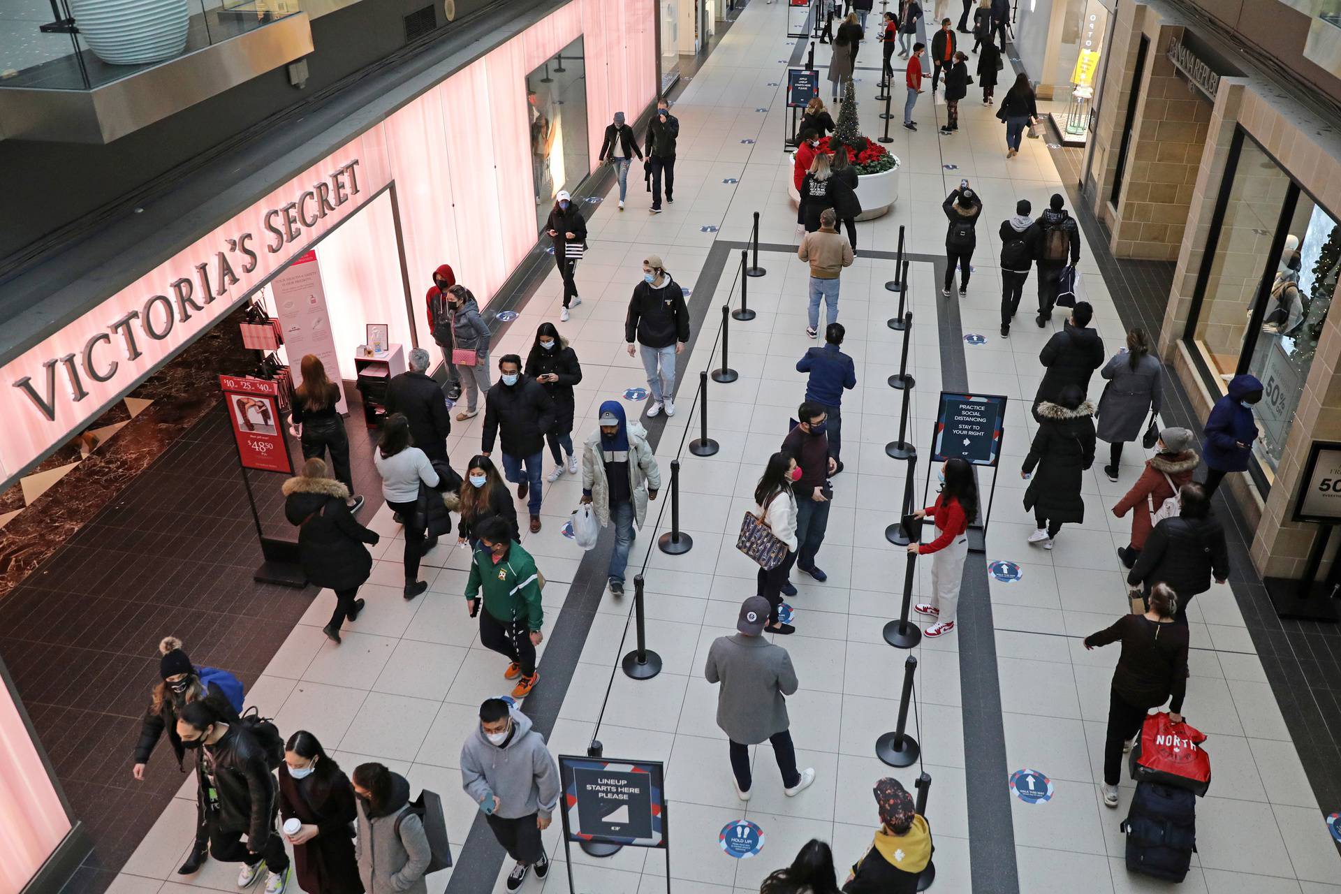 Shoppers pass a Victoria's Secret store at Eaton Centre mall in downtown Toronto