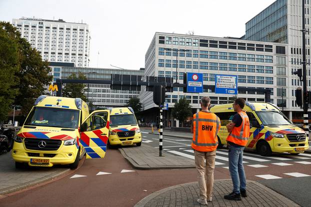 Police officers secure the area after Dutch police arrested a suspect after a shooting in Rotterdam