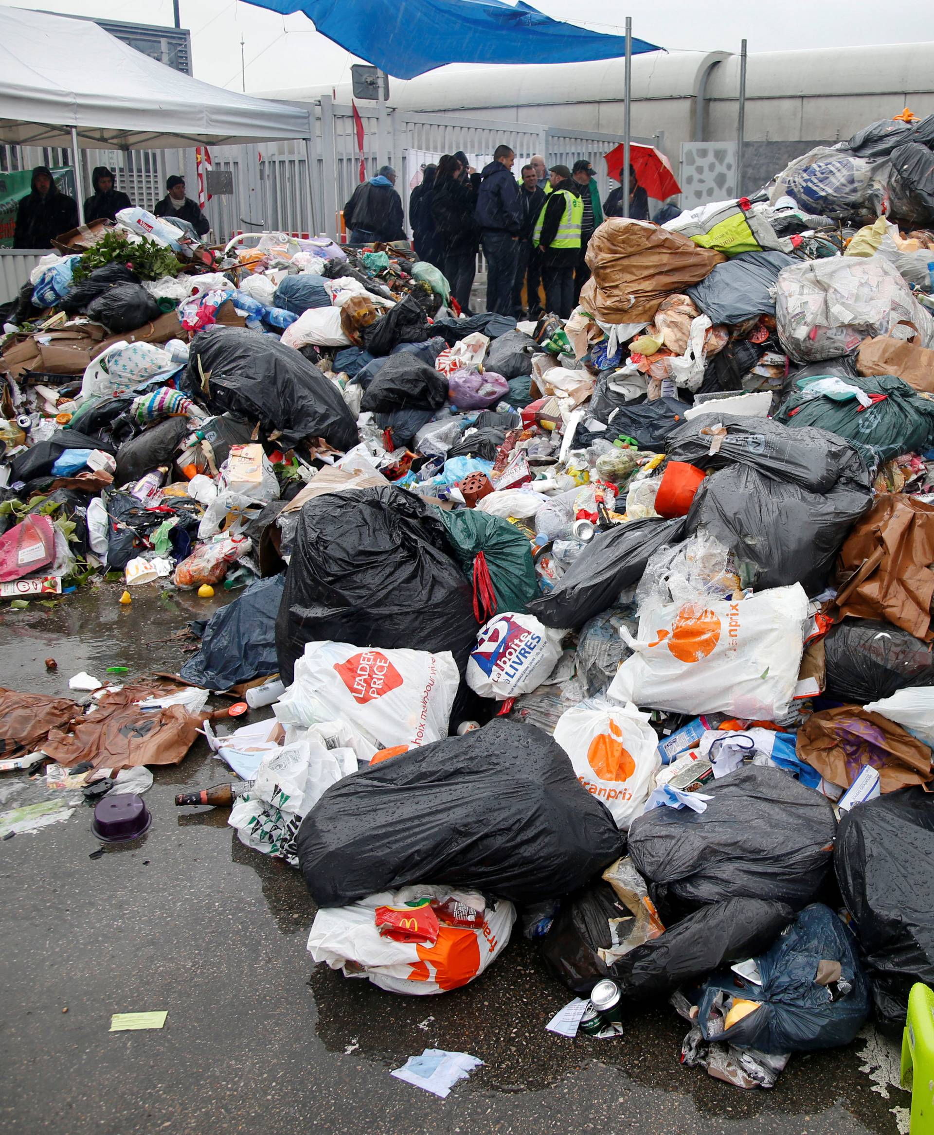 Striking French CGT labour union garbage collectors and sewer workers block access to the waste treatment center of Ivry-sur-Seine, near Paris