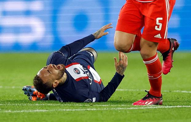 FILE PHOTO: Paris St Germain's Neymar goes down during Champions League round of 16 first leg v Bayern Munich