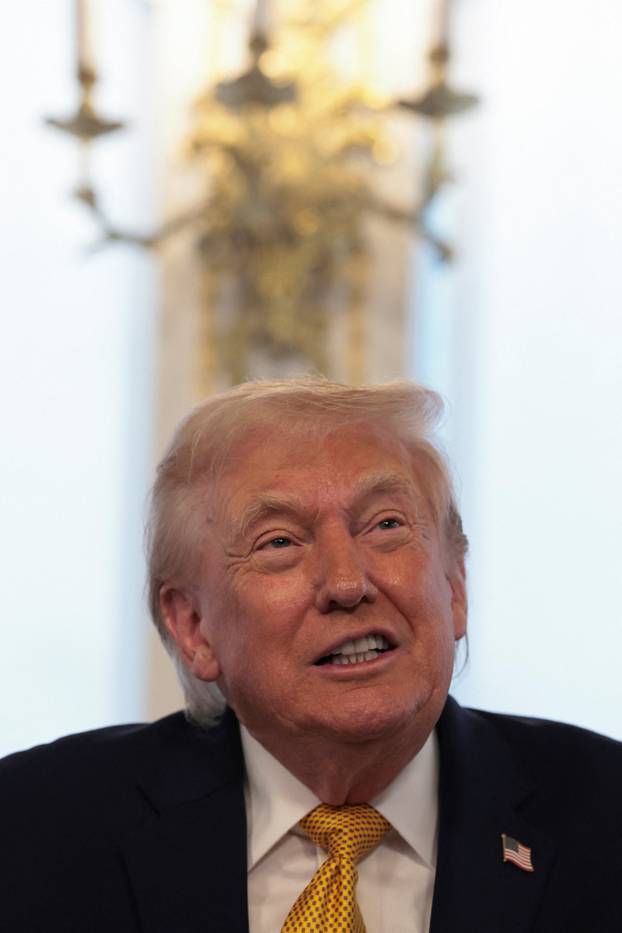 U.S. President Trump participates in calls to U.S. service members, on Christmas Eve, from the Mar-a-Lago club in Palm Beach