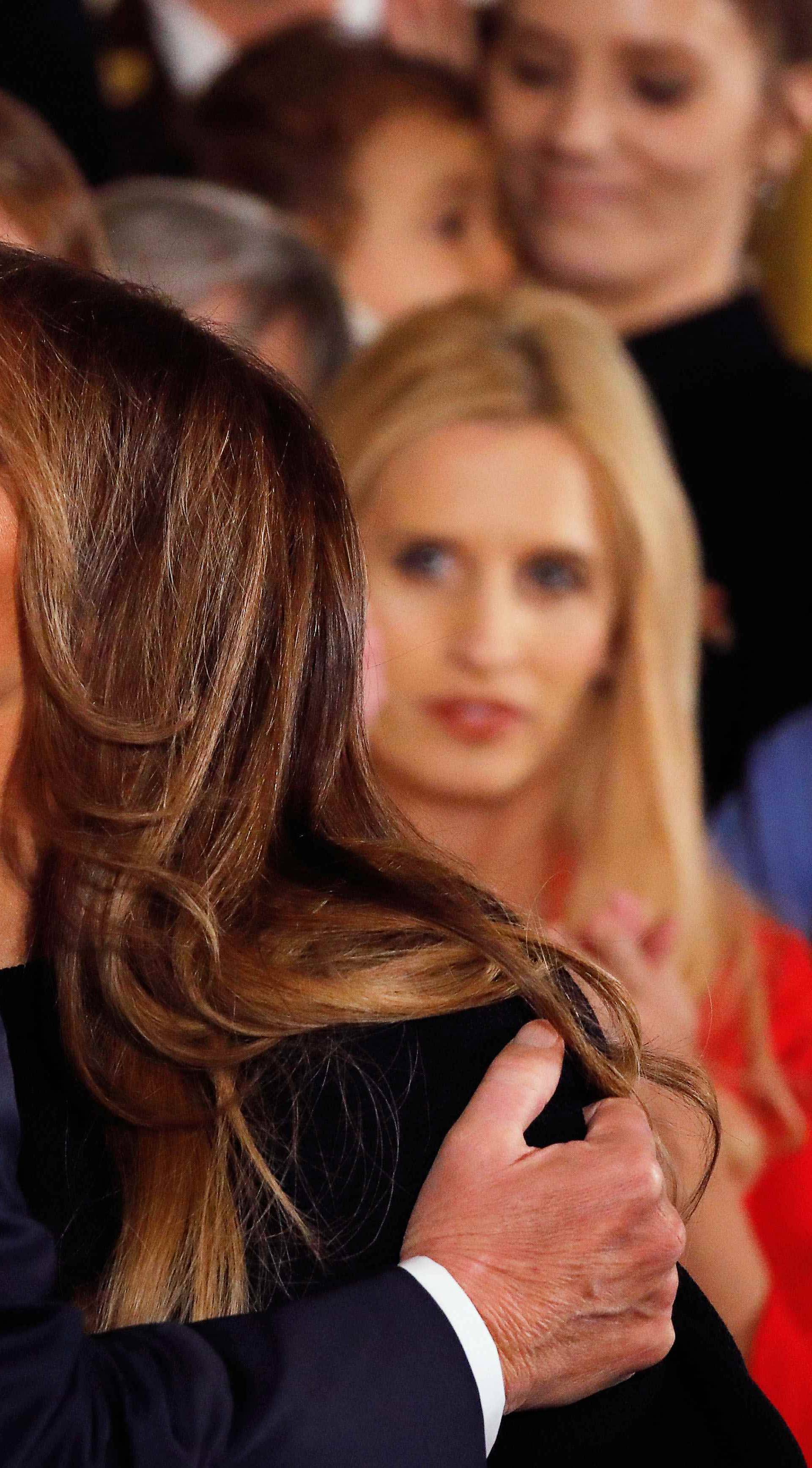 U.S. President Donald Trump embraces first lady Melania Trump before he speaks about administration plans to combat the nation's opioid crisis in the East Room of the White House in Washington