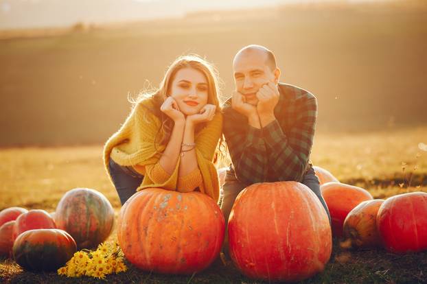 Beautiful couple spend time in a autumn park