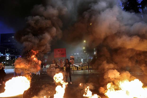 Families and supporters of hostages protest demanding the immediate release of hostages who were kidnapped during the deadly October 7 attack, amid the ongoing conflict in Gaza between Israel and Hamas, in Tel Aviv