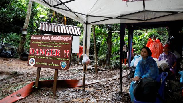 Rescue workers are seen near Tham Luang cave complex during a search for members of an under-16 soccer team and their coach, in the northern province of Chiang Rai