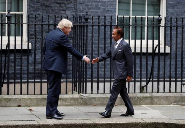 Britain's Prime Minister Boris Johnson meets Brunei's Sultan Hassanal Bolkiah, at Downing Street in London