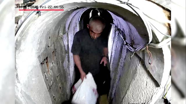 A screengrab from a handout video shows what the Israeli Army says is recently killed Hamas leader Yahya Sinwar walking through a tunnel before the October 7 attacks