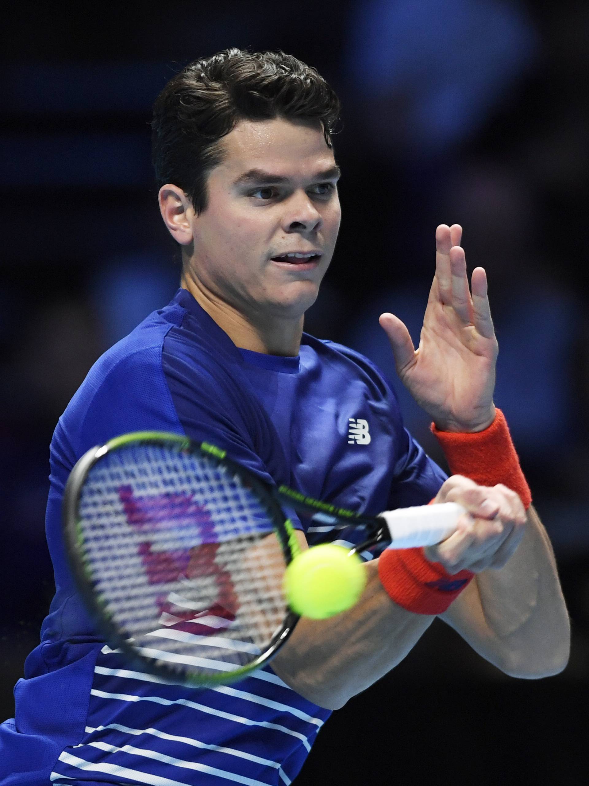 Canada's Milos Raonic in action during his round robin match with Serbia's Novak Djokovic