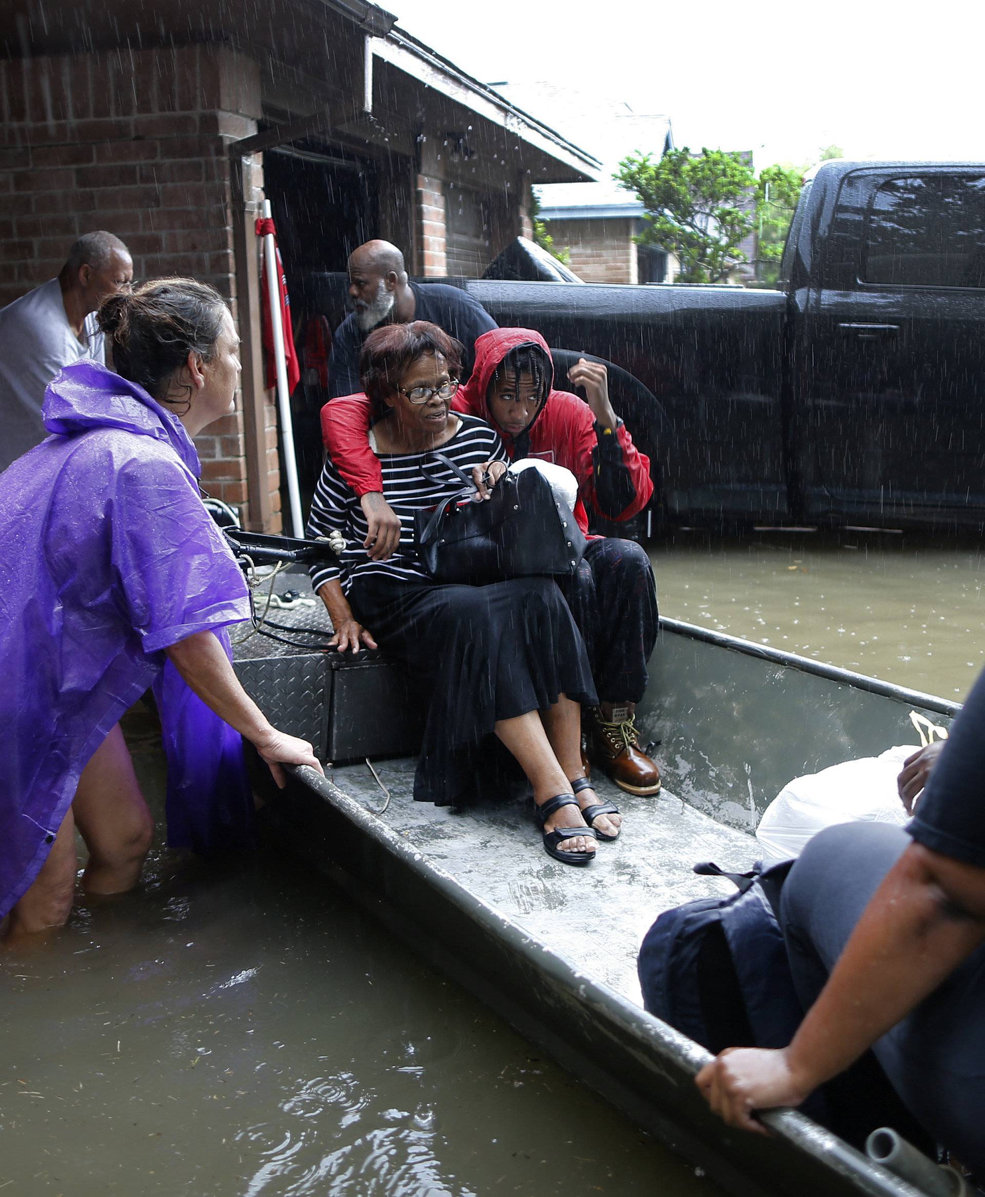 Hawkins family is rescued from the flood waters of Tropical Storm Harvey in Beaumont Place