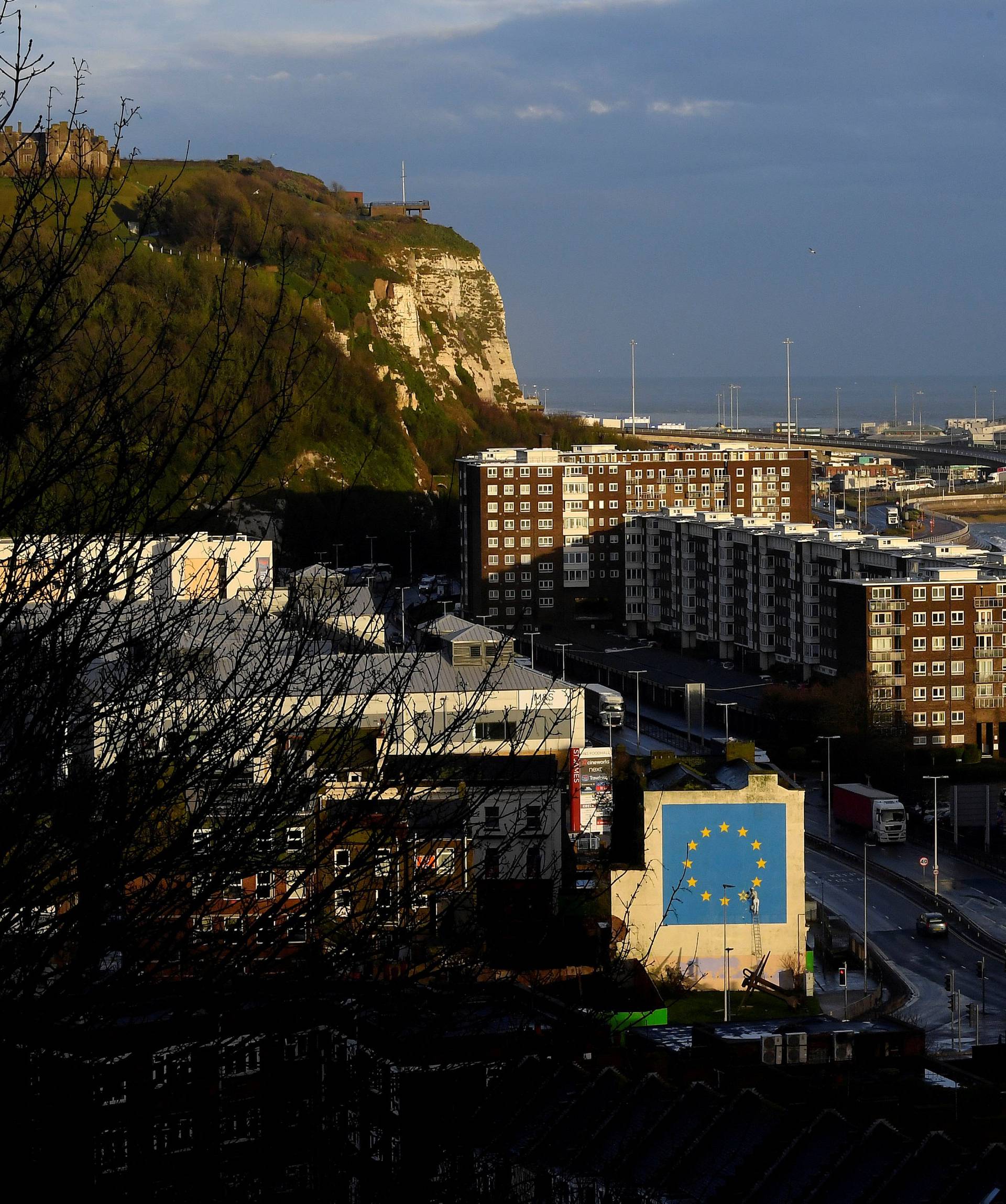 FILE PHOTO: A large mural depicting the EU flag being chipped away and attributed to the British artist Banksy is seen at the Port of Dover in south east Britain