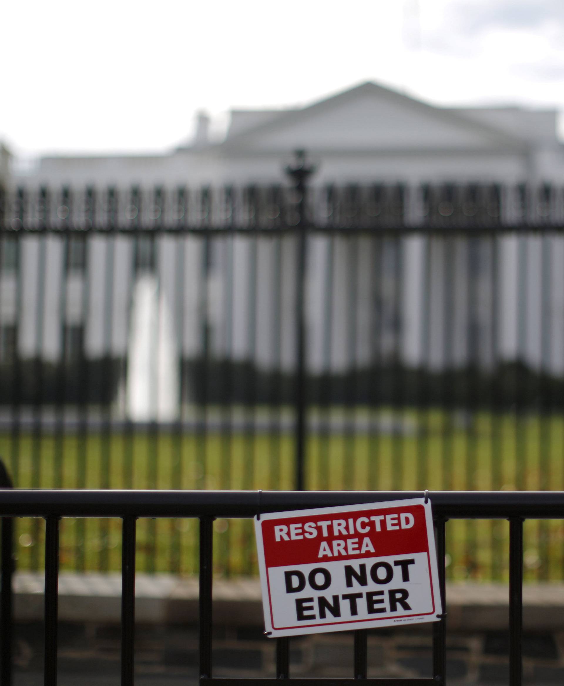 FILE PHOTO: A restricted area sign is seen outside of the White House in Washington