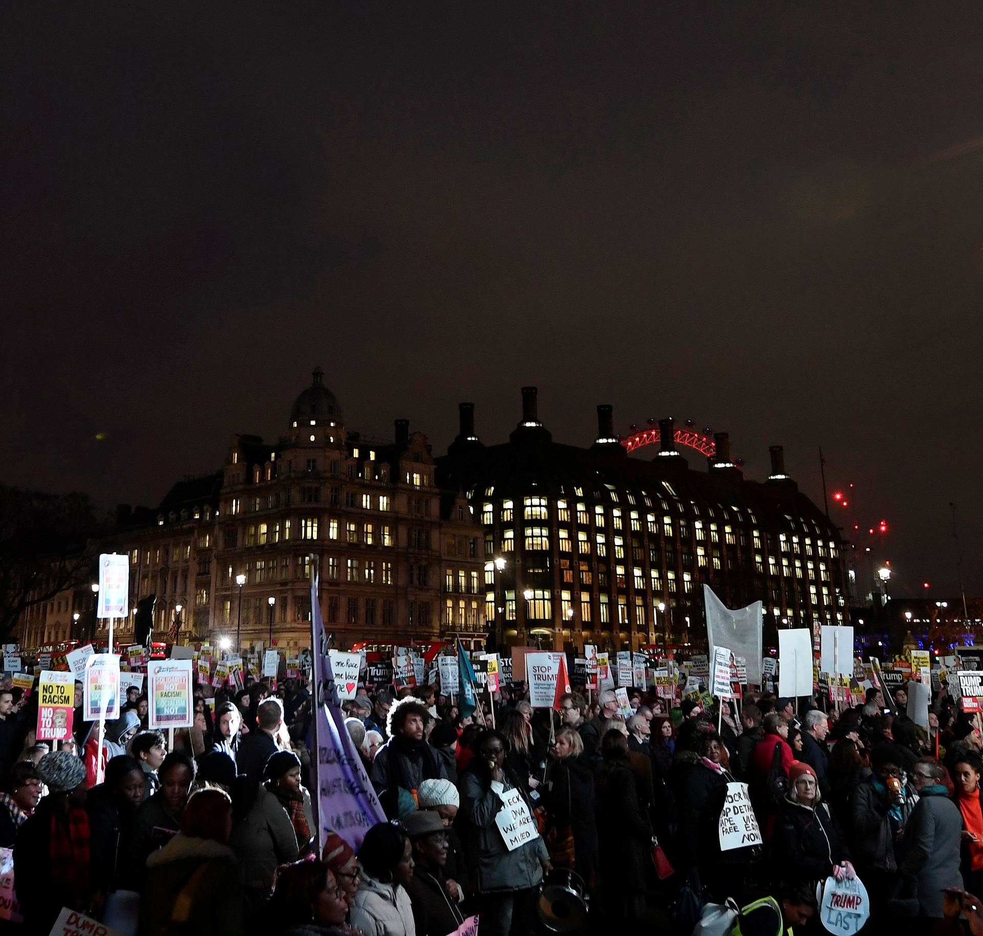 Demonstrators gather in front of the Houses of Parliament during a protest against U.S. President Donald Trump in London