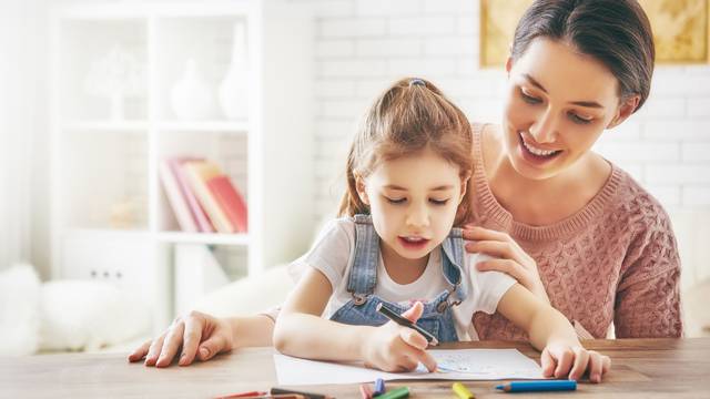 Mother and daughter together paint