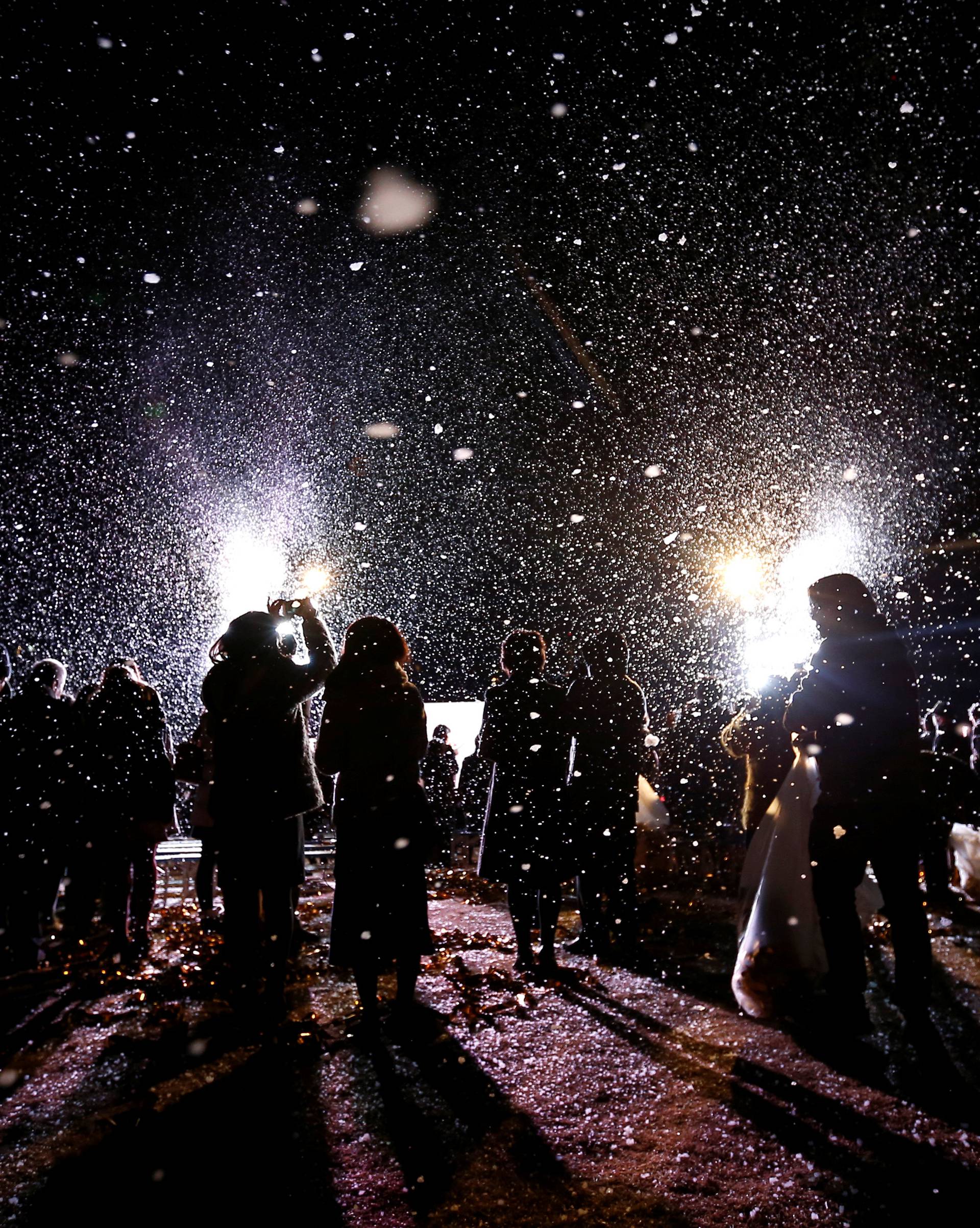 Revellers take part in New Year celebrations in artificial snow in Tokyo, Japan