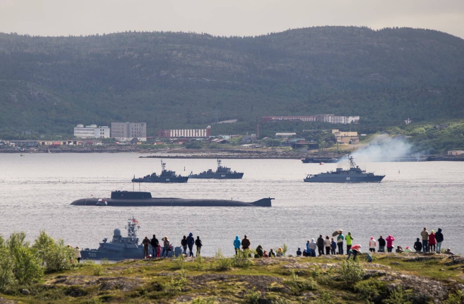Russian navy ships and a submarine take part in a naval parade at the port of Severomorsk