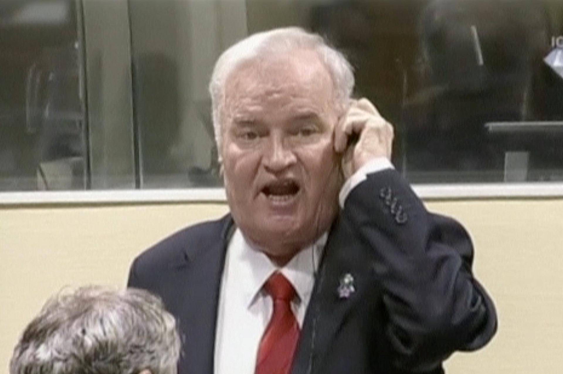 Ex-Bosnian Serb wartime general Ratko Mladic reacts in court at the International Criminal Tribunal for the former Yugoslavia in the Hague