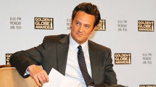 FILE PHOTO: Actor Matthew Perry waits to announce nominations at Golden Globes news conference in Beverly Hills