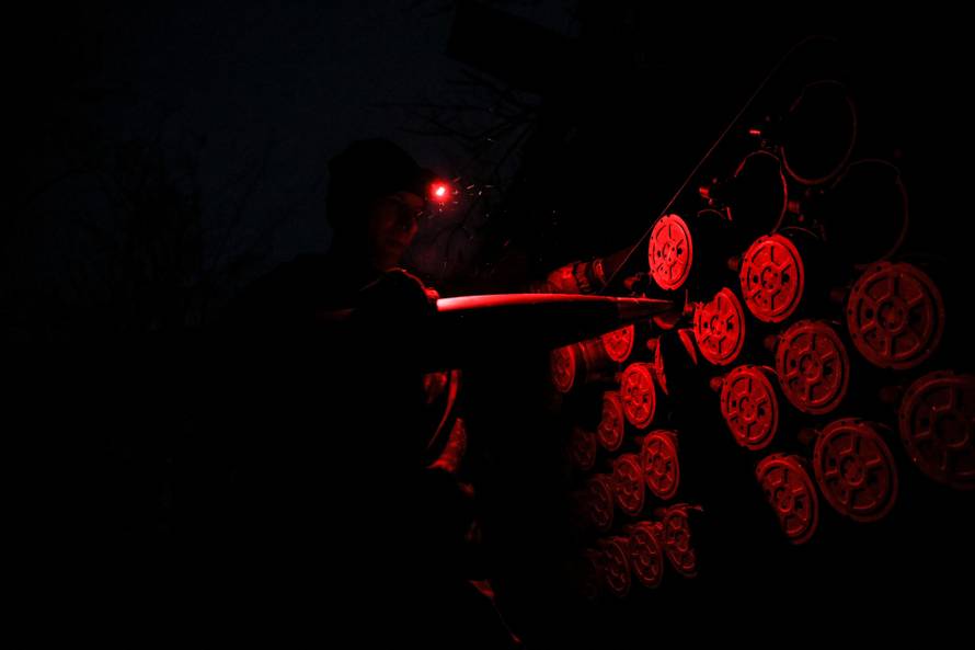 Ukrainian servicemen fire a Grad MLRS towards Russian troops near the frontline town of Chasiv Yar