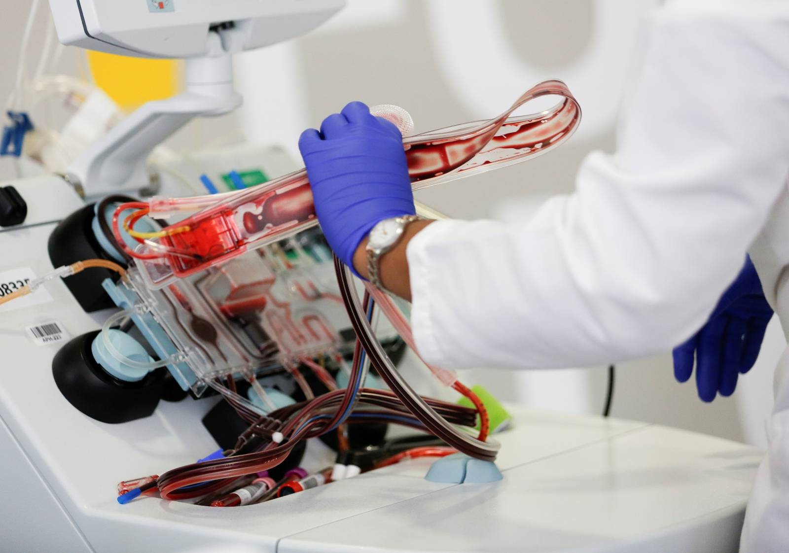 FILE PHOTO: Phlebotomist Wilson takes apart an apheresis kit after processing convalescent plasma for an experimental treatment study during the coronavirus disease (COVID-19) outbreak in Seattle