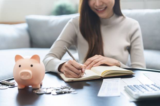 Saving,Money,Wealth,Concept,,Asian,Young,Business,Woman,Hand,Write