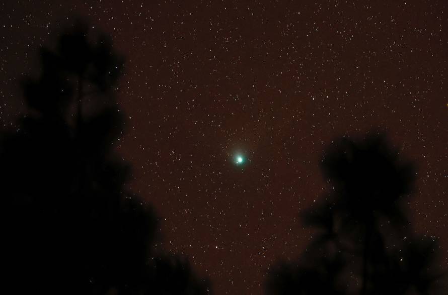 A green comet named Comet C/2022 E3 (ZTF), which last passed by our planet about 50,000 years ago is seen from the Pico de las Nieves