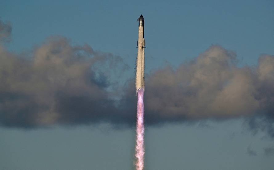 A SpaceX Super Heavy booster carrying the Starship spacecraft lifts off on its 11th test flight