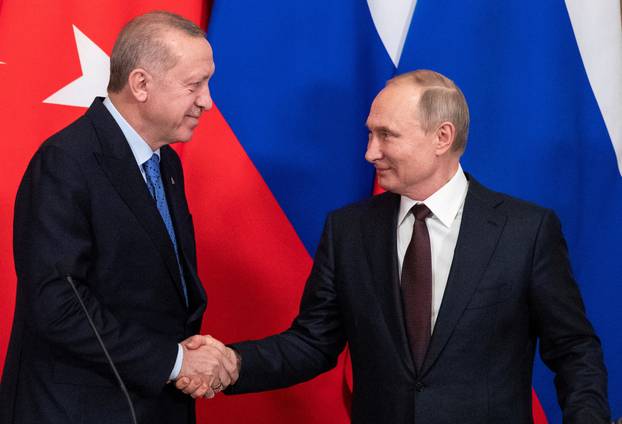 FILE PHOTO: Russian President Putin meets with Turkish President Erdogan in Moscow