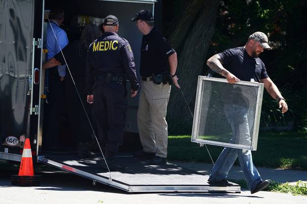 FILE PHOTO: Police officials unload equipment as they continue to investigate a home that accused serial killer Bruce McArthur worked at in Toronto