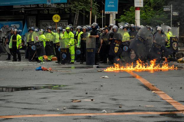 Filipinos protest to denounce what they say is corruption linked to flood control projects, in Manila