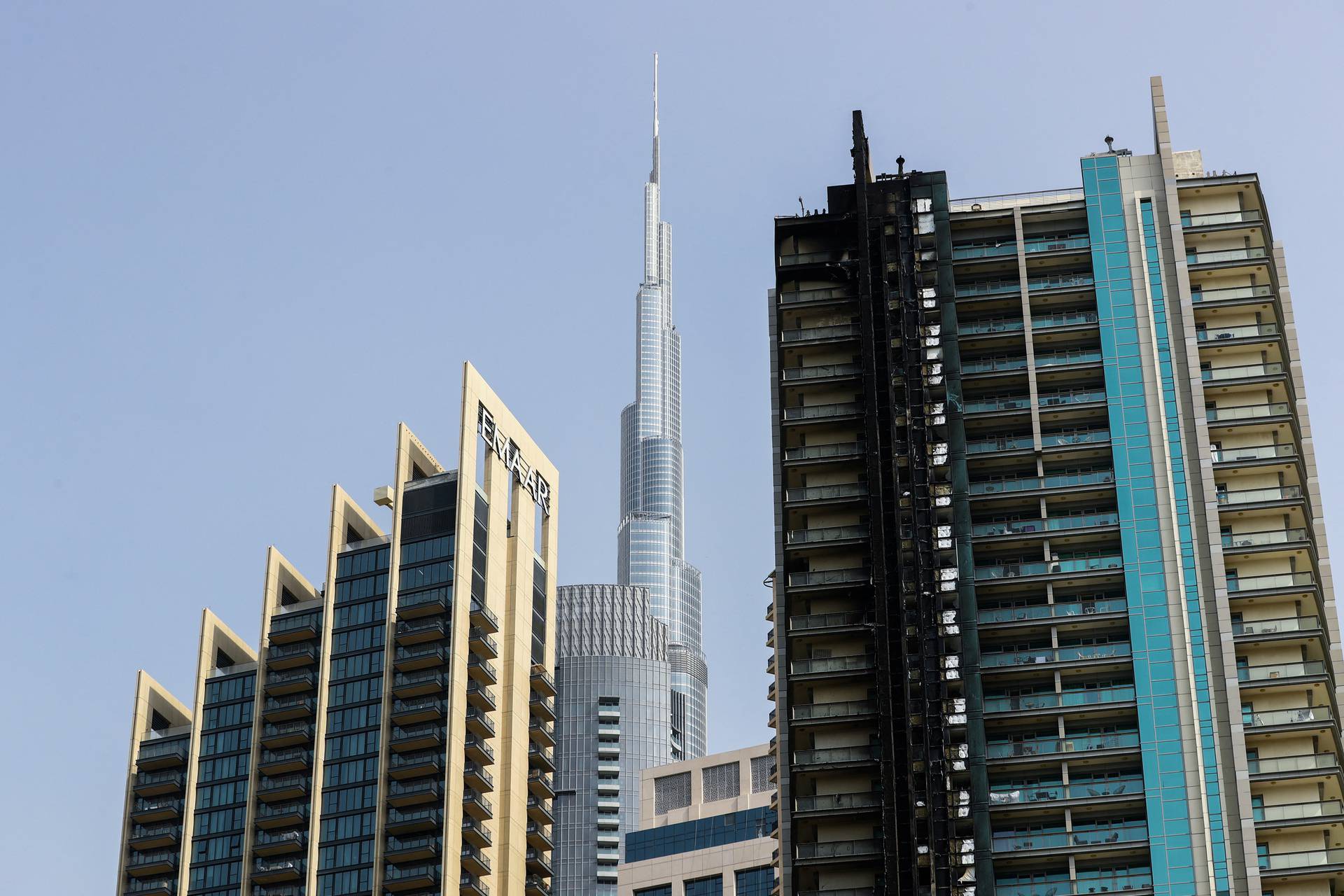 Fire damage is visible on the 8 Boulevard Walk high-rise building located near Burj Khalifa in Dubai