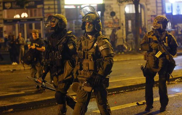 German special police forces walk through the Schanze district following clashes with anti G20-protesters in Hamburg