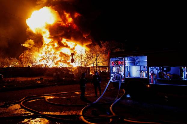 Rescuers work at the site of a Russian missile strike, amid Russia's attack on Ukraine, in Kyiv