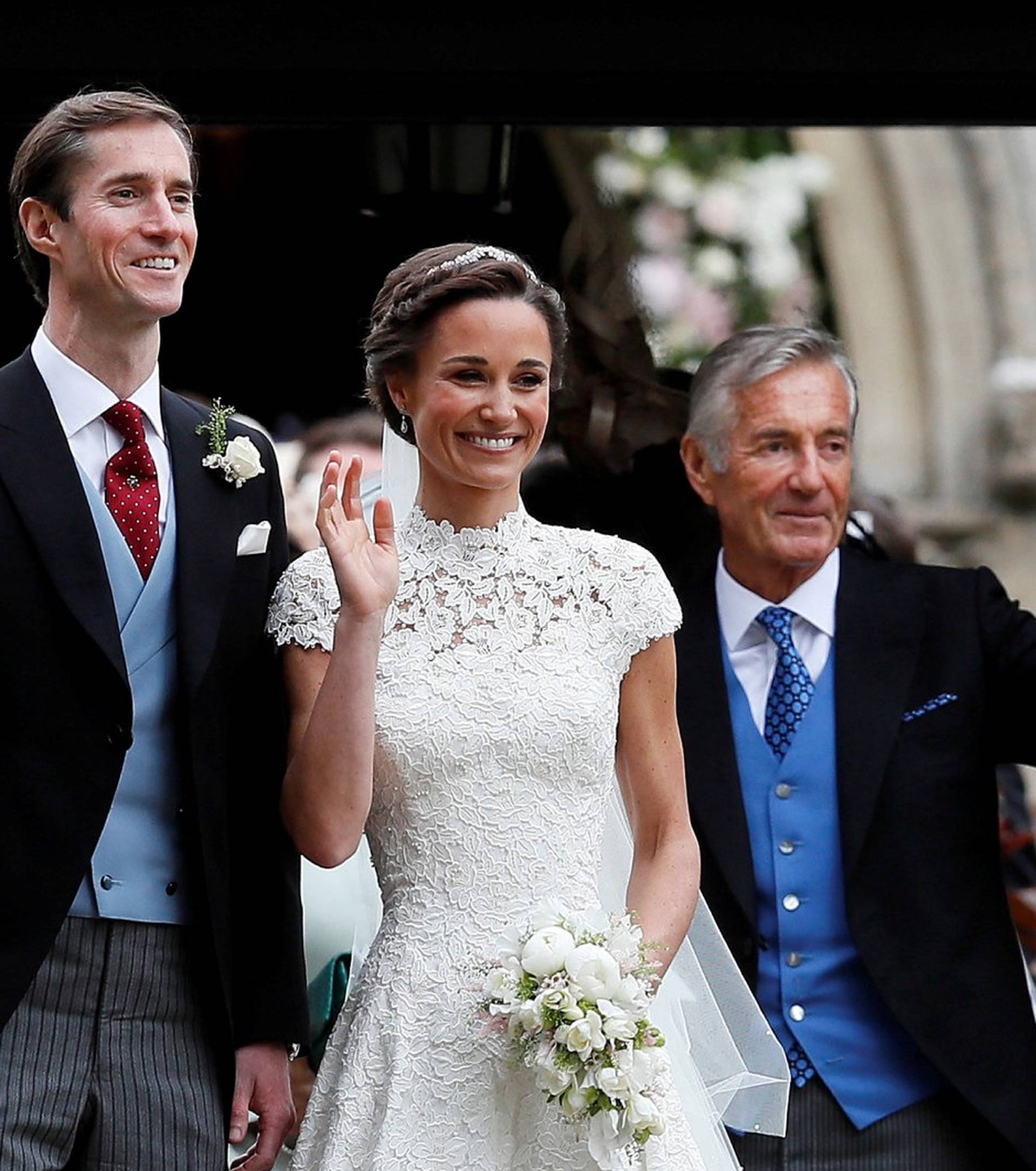 FILE PHOTO: Pippa Middleton and James Matthews pose for photographs after their wedding at St Mark's Church in Englefield