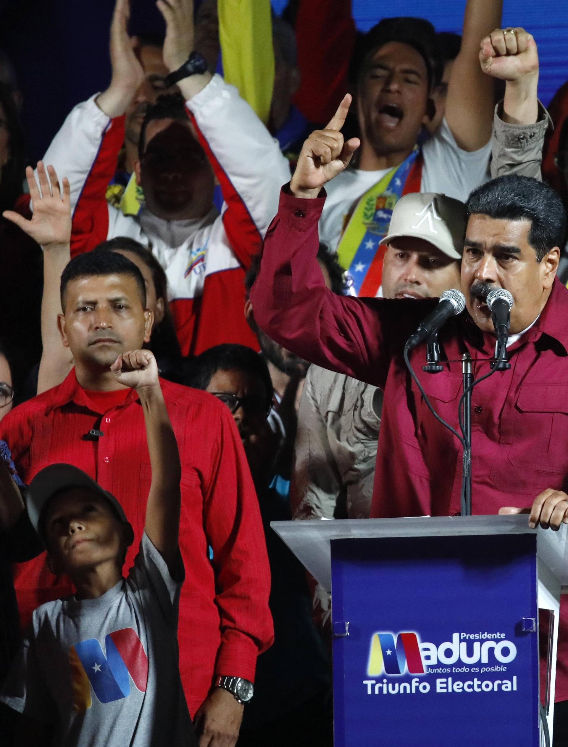 Venezuela's President Maduro stands with supporters after the results of the election were released in Caracas