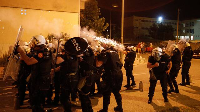 Riot police fire tear gas in front of police station in Podgorica