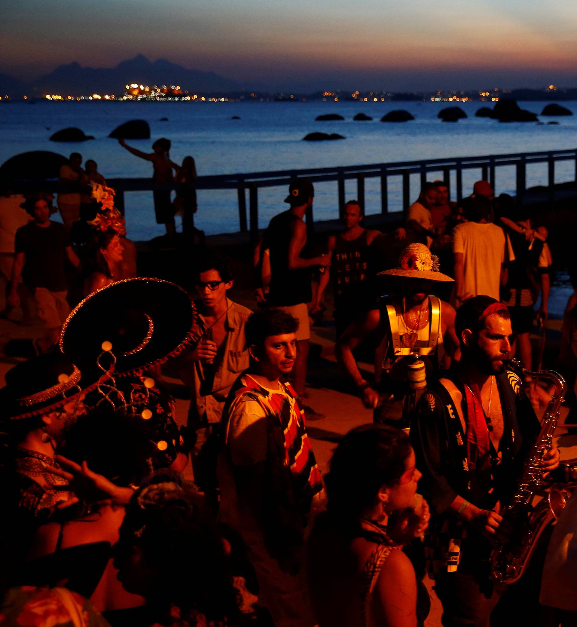 Revellers take part in the annual block party in Paqueta island during pre-carnival festivities on Guanabara bay, Rio de Janeiro