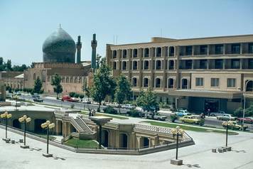 This cityscape image looking towards the Madresse Madac-I-Shah mosque and school and the Chahar Bagh Avenue is one of the main roads in the cultural city of Isfahan as it was in 1978